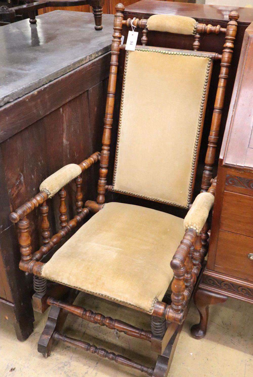 A late 19th century American walnut rocking chair, W.56cm